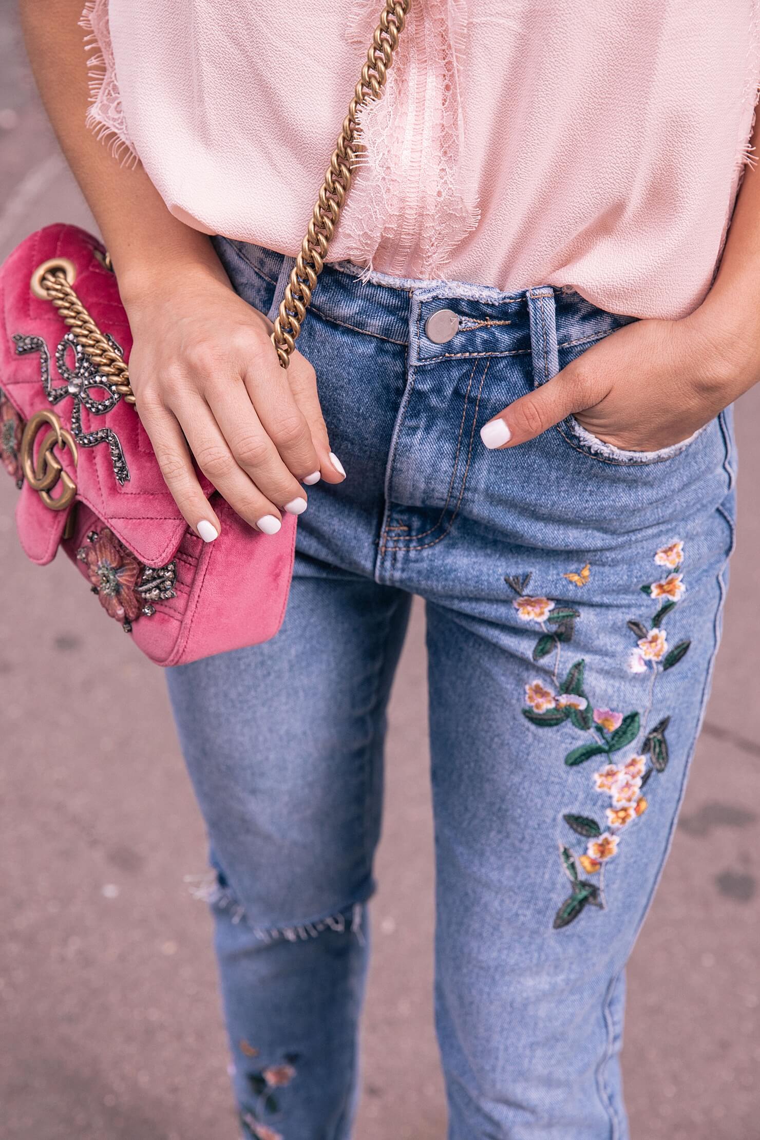 rose embroidered jeans with lace sleepless blouse and gucci velvet bag 