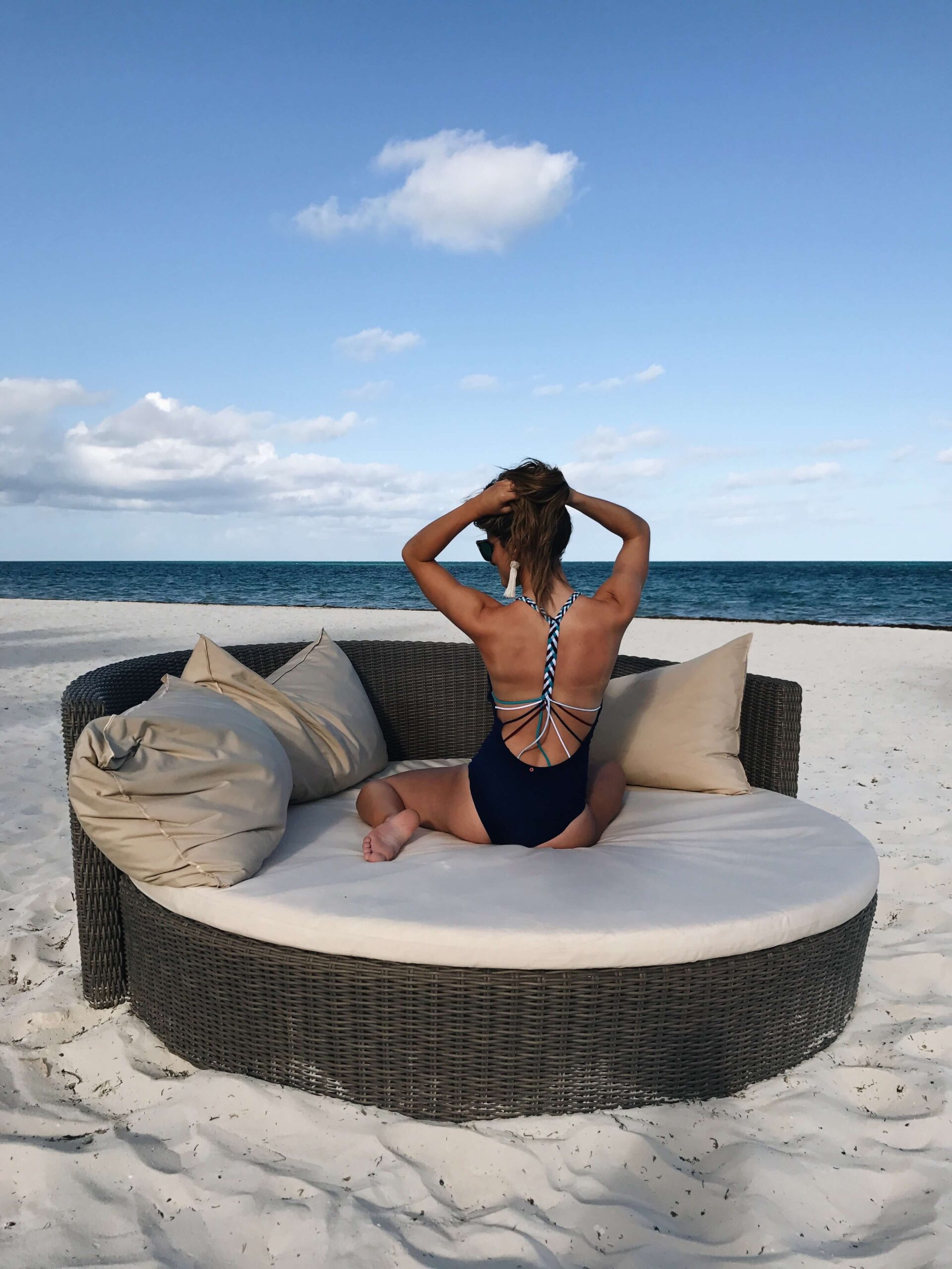 brighton keller in cancun mexico with one piece swimsuit