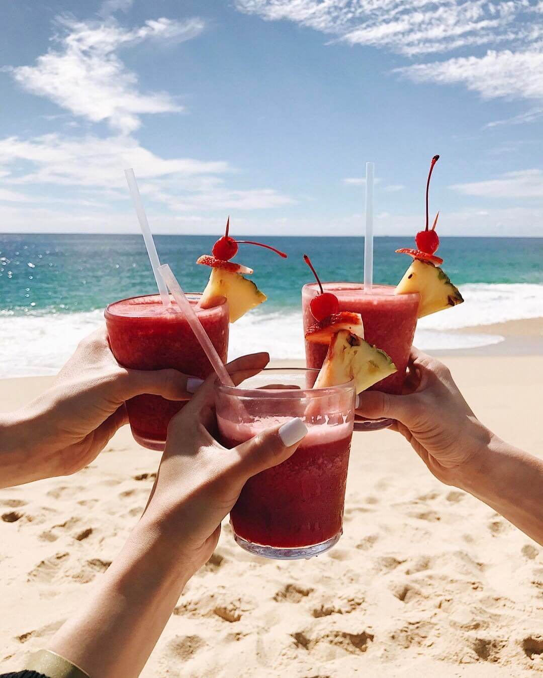 strawberry daiquiris on the beach in cabo