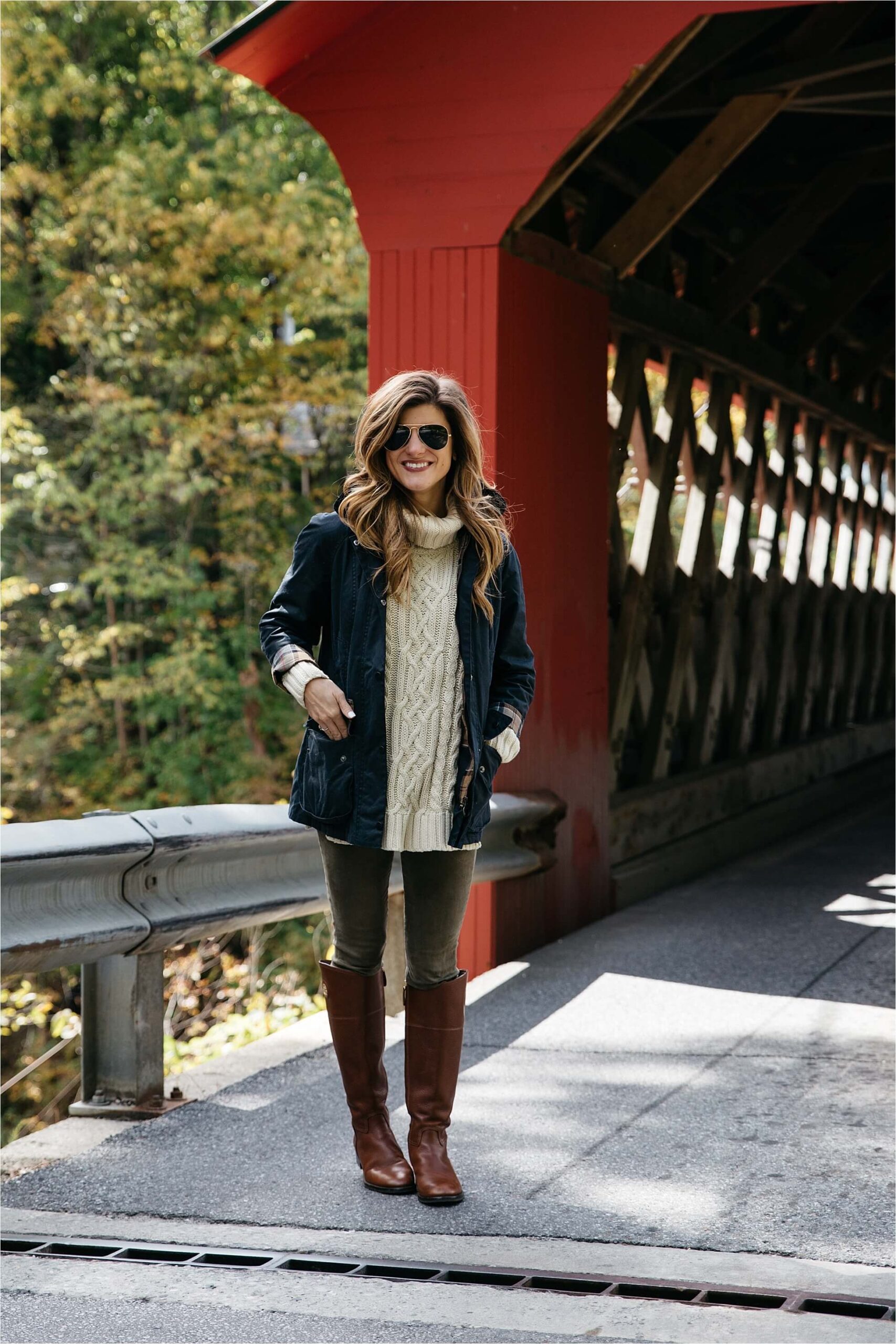 Fall outfit, tory burch riding boots, barbour jacket, olive green pants, oversized cableknit turtleneck sweater covered bridge in Vermont