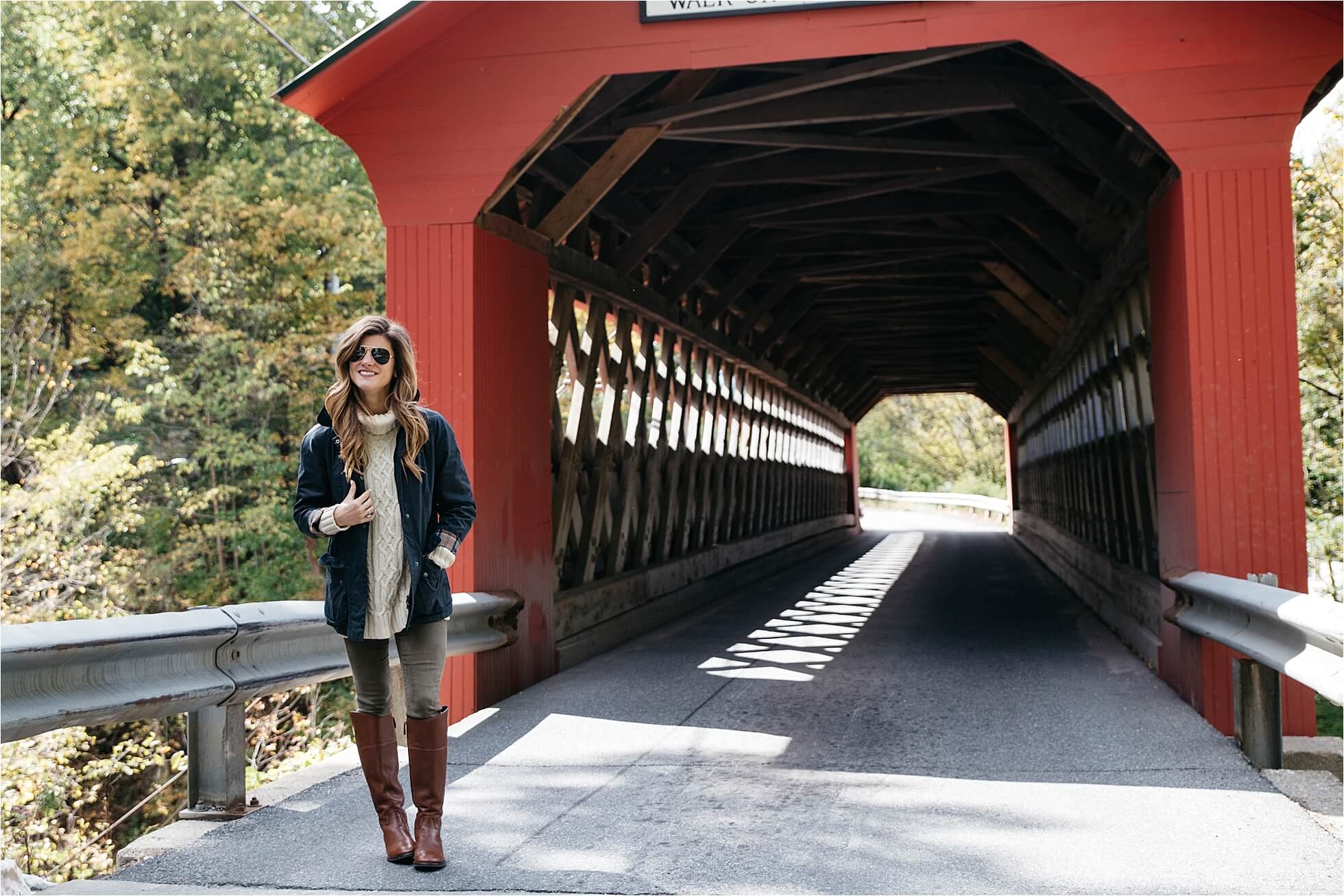 Fall outfit, tory burch riding boots, barbour jacket, olive green pants, oversized cableknit turtleneck sweater covered bridge in Vermont
