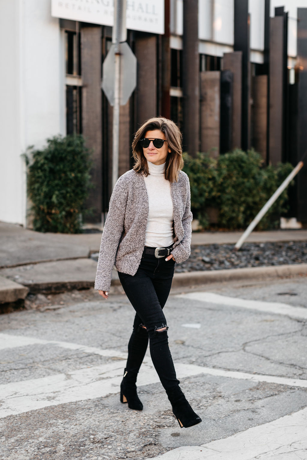 winter outfit black jeans cream turtleneck cropped cardigan western belt