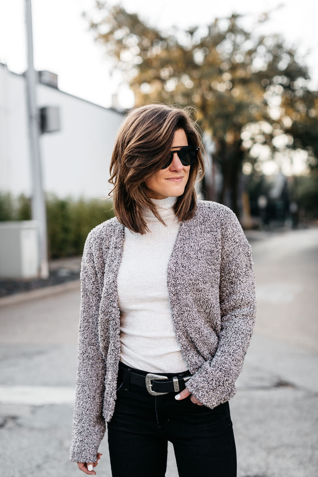winter outfit black jeans cream turtleneck cropped cardigan western belt