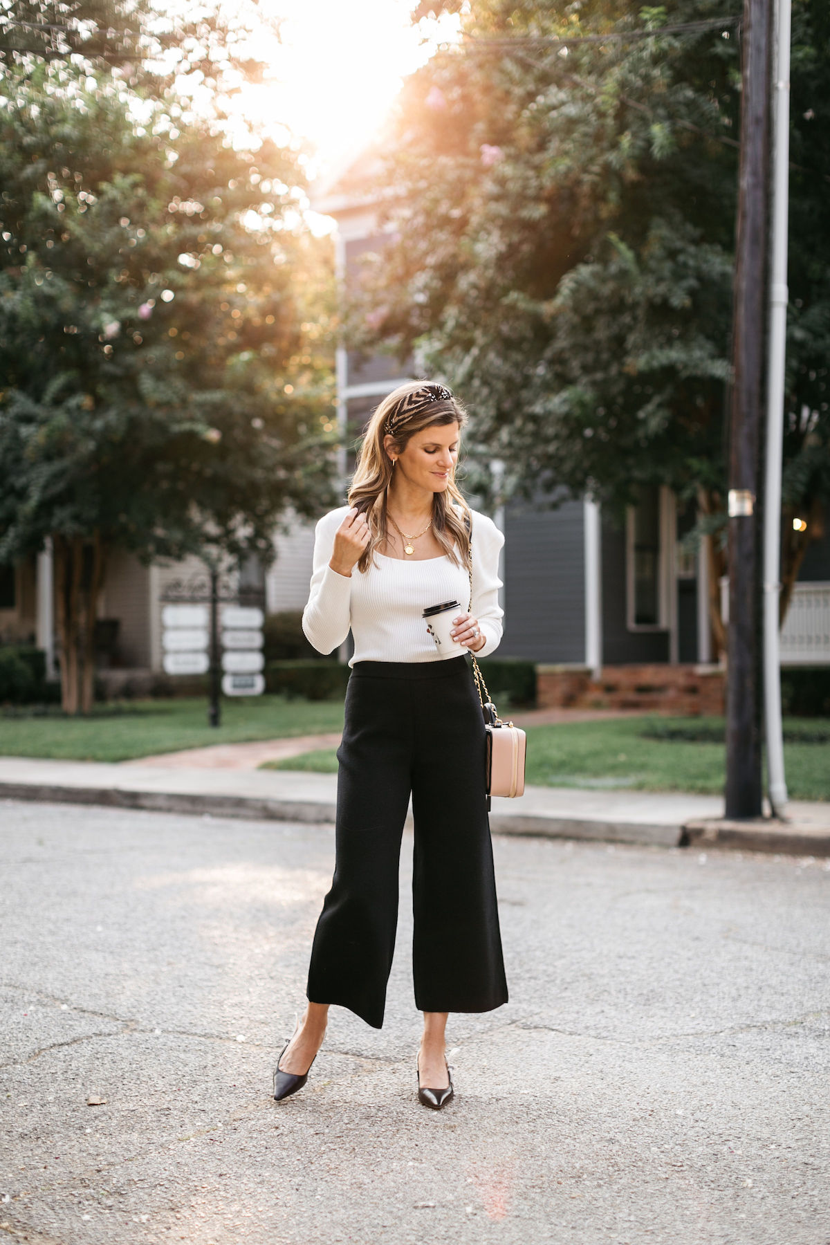 work outfit brighton butler wearing jcrew black pants and cream sweater businss casual 1a